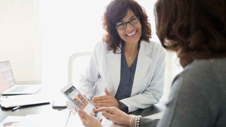Doctor reviewing eye map on tablet