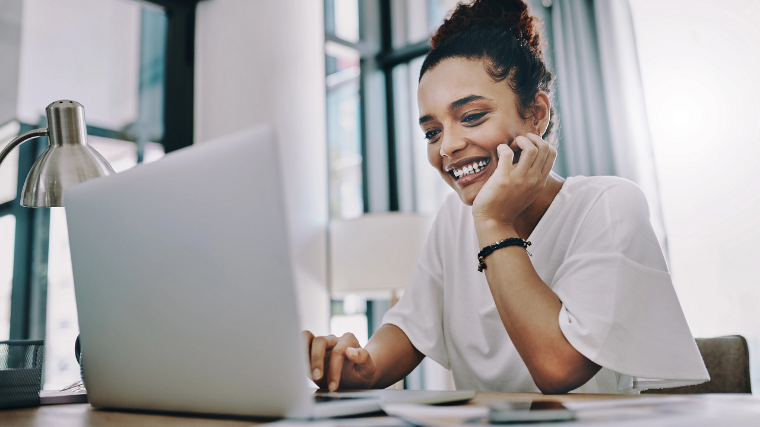 Woman at home on her laptop